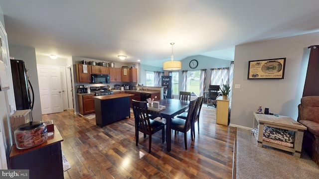 69 Geisinger Ln, Lewistown, PA 17044 - dining area with dark wood-style flooring, lofted ceiling, and baseboards