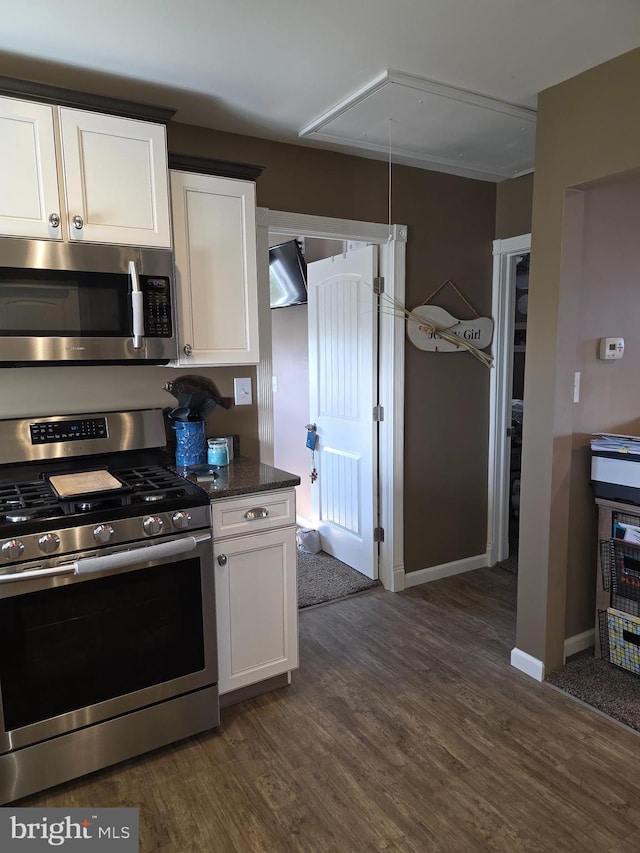 367 Dock Rd, West Creek, NJ 08092 - kitchen featuring stainless steel appliances, dark wood-style flooring, white cabinetry, baseboards, and dark stone counters