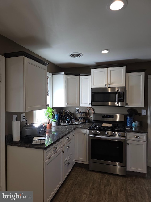 367 Dock Rd, West Creek, NJ 08092 - kitchen featuring stainless steel appliances, dark wood finished floors, white cabinets, recessed lighting, and dark stone countertops