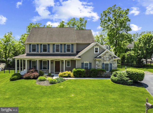 6 Falcon Cir, Lebanon, PA 17042 - view of front facade featuring stone siding, a porch, and roof with shingles