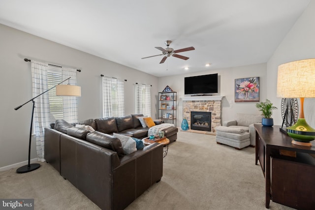 6 Falcon Cir, Lebanon, PA 17042 - living room featuring light carpet, a ceiling fan, a stone fireplace, and baseboards