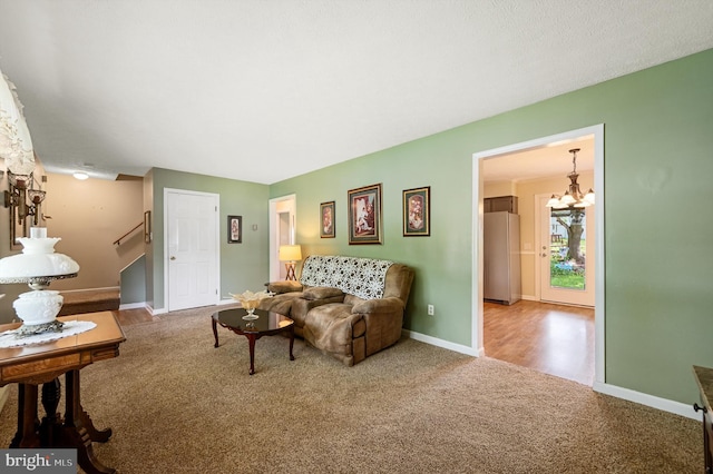 108 Oakmont Cir, Winchester, VA 22602 - carpeted living area with a chandelier and stairway