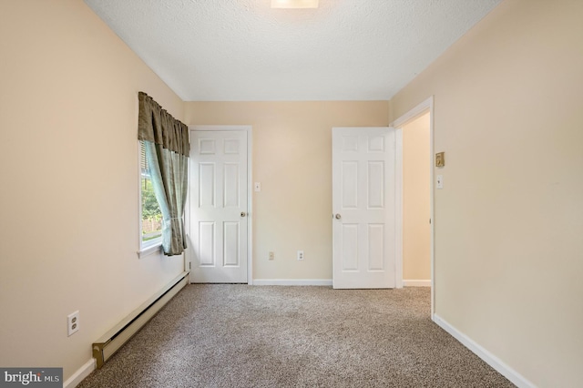 108 Oakmont Cir, Winchester, VA 22602 - unfurnished bedroom with a baseboard heating unit, carpet, and a textured ceiling