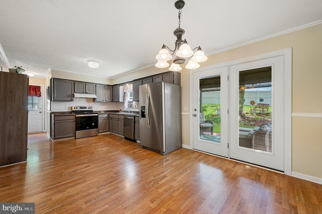 108 Oakmont Cir, Winchester, VA 22602 - kitchen with stainless steel appliances, a chandelier, ornamental molding, light wood-type flooring, and dark countertops