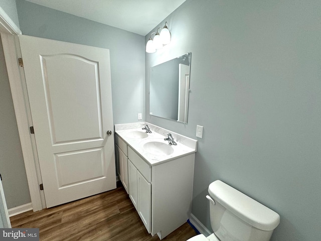 230 Spring Hollow Rd, Front Royal, VA 22630 - bathroom with wood finished floors, double vanity, and toilet