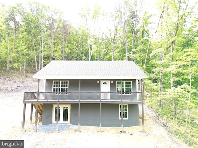 230 Spring Hollow Rd, Front Royal, VA 22630 - view of front of home with a wooden deck, a forest view, french doors, and roof with shingles
