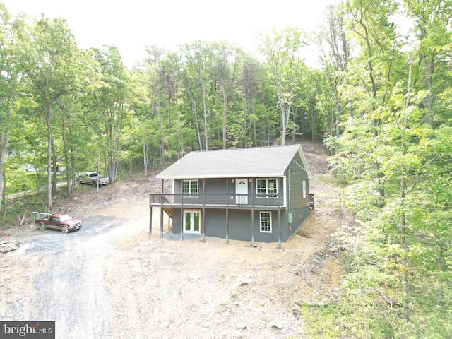 230 Spring Hollow Rd, Front Royal, VA 22630 - view of front facade featuring a wooden deck, a wooded view, and dirt driveway
