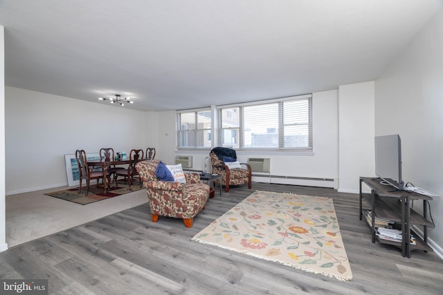 1301 N Harrison St Unit 1108, Wilmington, DE 19806 - living room with a baseboard radiator, wood finished floors, and baseboards