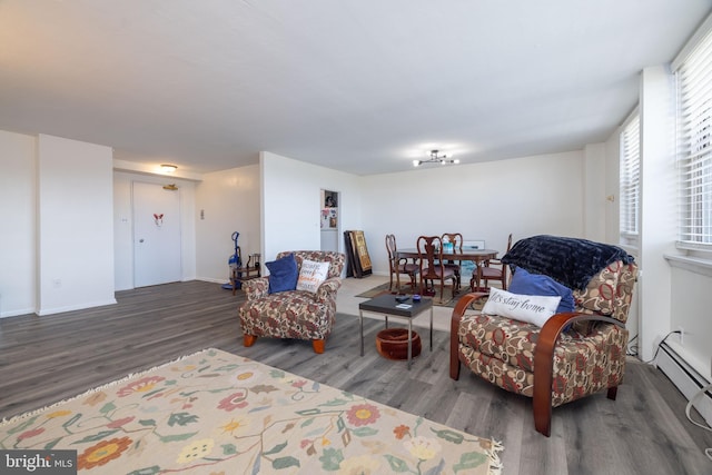 1301 N Harrison St Unit 1108, Wilmington, DE 19806 - living area featuring wood finished floors, baseboards, and baseboard heating