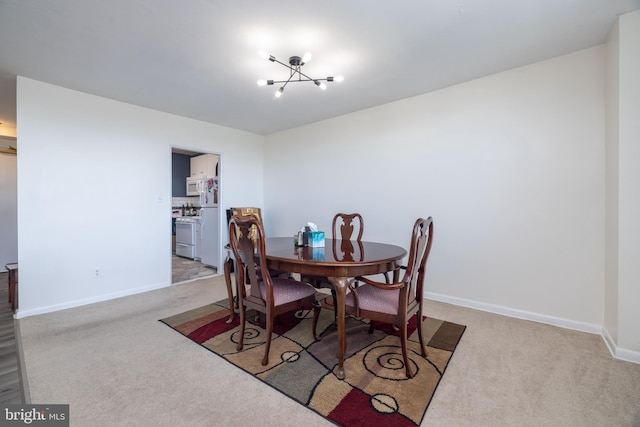 1301 N Harrison St Unit 1108, Wilmington, DE 19806 - carpeted dining room featuring baseboards and a chandelier