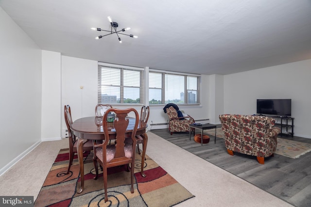1301 N Harrison St Unit 1108, Wilmington, DE 19806 - carpeted dining space featuring baseboard heating, a chandelier, and baseboards