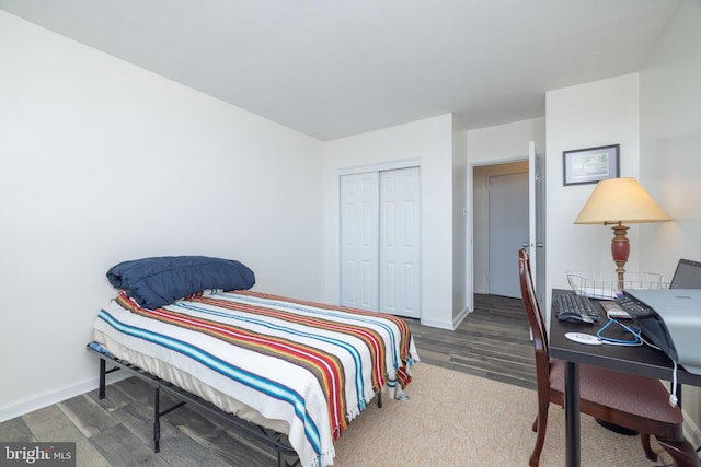 1301 N Harrison St Unit 1108, Wilmington, DE 19806 - bedroom featuring wood finished floors, a closet, and baseboards