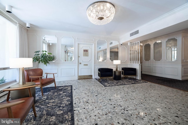 1301 N Harrison St Unit 1108, Wilmington, DE 19806 - living room featuring ornamental molding, a decorative wall, a chandelier, and a fireplace