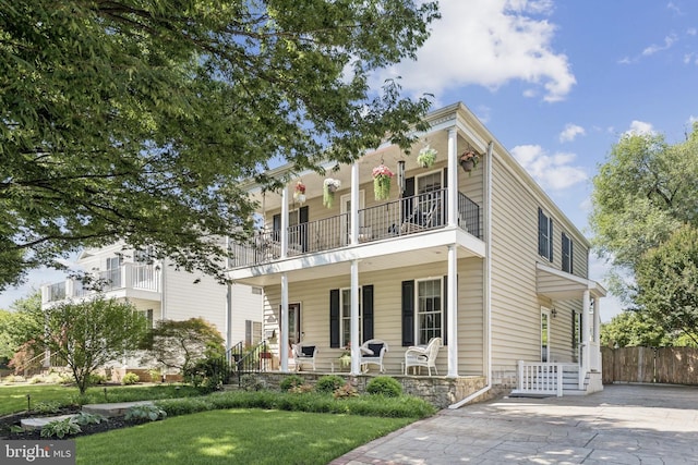 2606 Caroline St, Fredericksburg, VA 22401 - view of front of house with a balcony, a porch, and stone siding