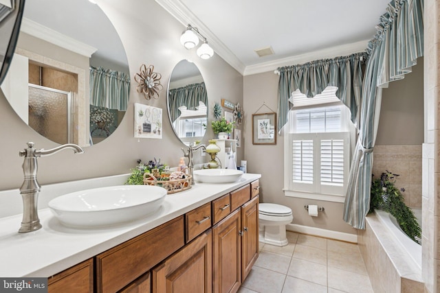 2606 Caroline St, Fredericksburg, VA 22401 - full bathroom featuring tiled shower, ornamental molding, double vanity, tile patterned flooring, and toilet