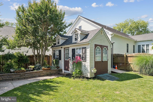 2606 Caroline St, Fredericksburg, VA 22401 - view of front facade with an outdoor structure and a shingled roof