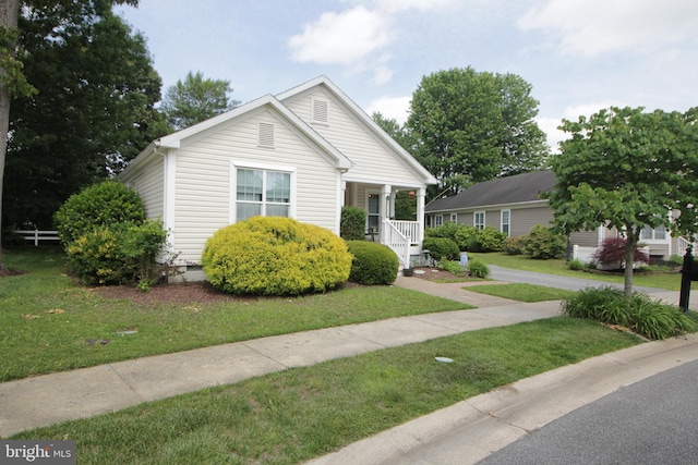 32530 Approach Unit 3252, Long Neck, DE 19966 - view of front facade with a front yard, covered porch, and crawl space