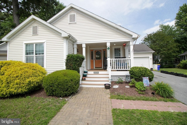 32530 Approach Unit 3252, Long Neck, DE 19966 - view of front of home featuring covered porch, driveway, and an attached garage