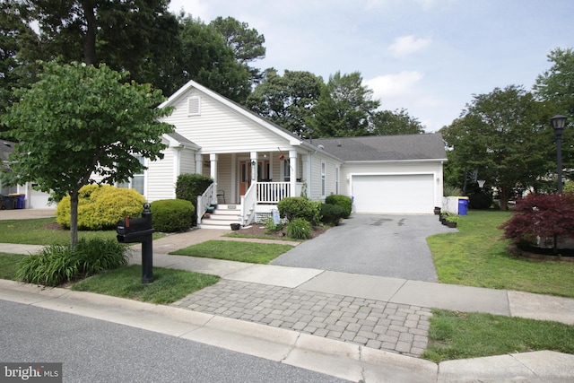 32530 Approach Unit 3252, Long Neck, DE 19966 - view of front of house with a porch, asphalt driveway, an attached garage, and a front yard