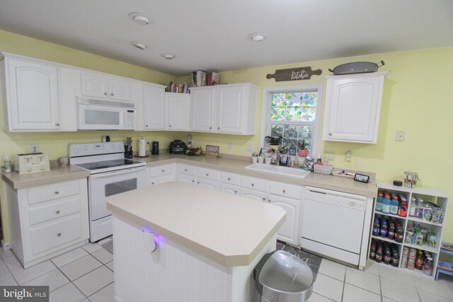 32530 Approach Unit 3252, Long Neck, DE 19966 - kitchen with white appliances, light tile patterned flooring, white cabinets, and light countertops