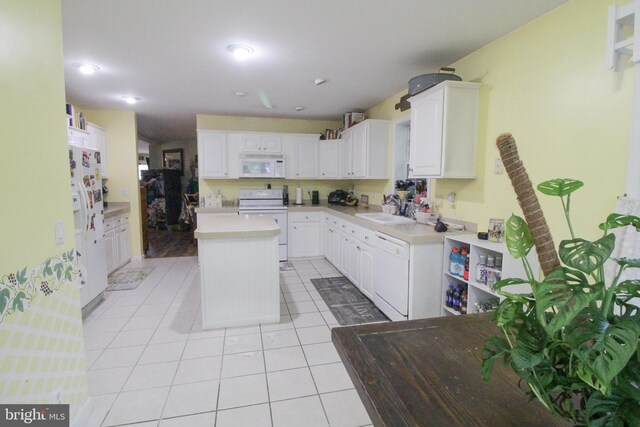 32530 Approach Unit 3252, Long Neck, DE 19966 - kitchen with white appliances, light tile patterned flooring, white cabinets, and a center island
