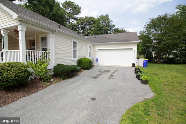 32530 Approach Unit 3252, Long Neck, DE 19966 - view of front of property with asphalt driveway, an attached garage, a front yard, a shingled roof, and covered porch