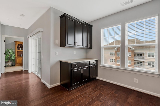 20620 Hope Spring Ter Unit 401, Ashburn, VA 20147 - bar area featuring dark wood-style flooring and baseboards