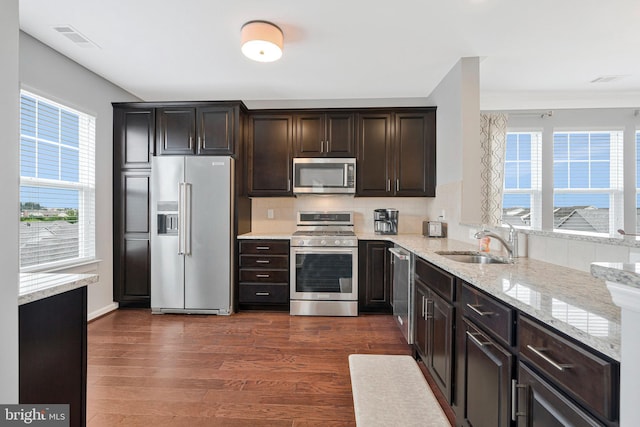 20620 Hope Spring Ter Unit 401, Ashburn, VA 20147 - kitchen with stainless steel appliances, a sink, healthy amount of natural light, and dark wood-type flooring