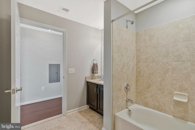 20620 Hope Spring Ter Unit 401, Ashburn, VA 20147 - full bath with electric panel, tub / shower combination, vanity, tile patterned flooring, and baseboards