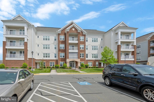 20620 Hope Spring Ter Unit 401, Ashburn, VA 20147 - view of property featuring uncovered parking