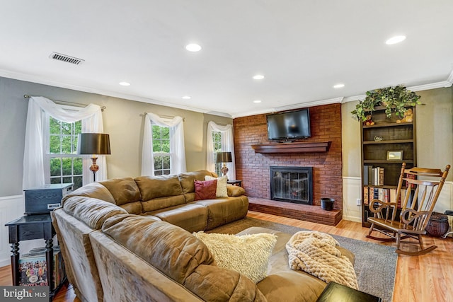 5901 Wivenhoe Ct, Alexandria, VA 22315 - living area with crown molding, wood finished floors, a fireplace, and recessed lighting