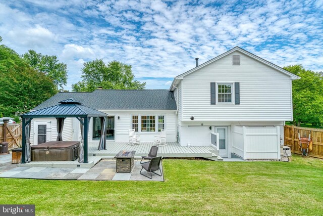 5901 Wivenhoe Ct, Alexandria, VA 22315 - back of property featuring a hot tub, a deck, a gazebo, and a patio area