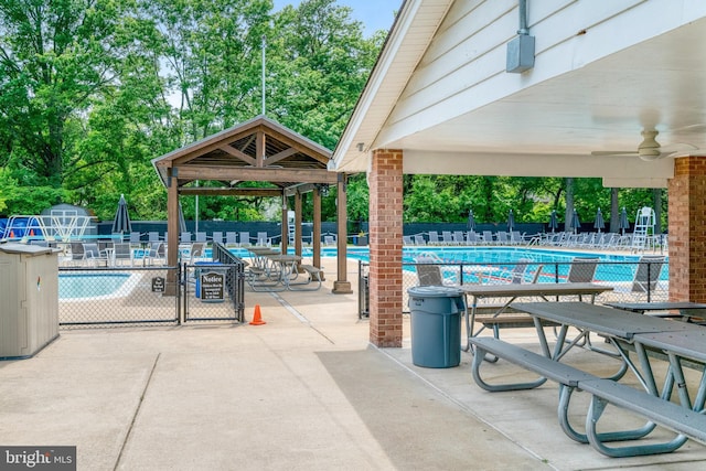 5901 Wivenhoe Ct, Alexandria, VA 22315 - community pool featuring a gazebo, view of wooded area, ceiling fan, and a patio