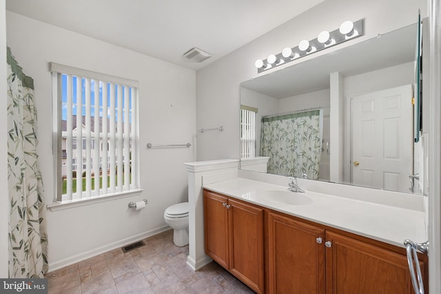 101 Glencoe Ct, Newark, DE 19702 - bathroom featuring vanity, toilet, and baseboards
