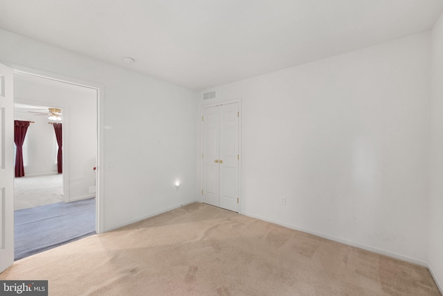 101 Glencoe Ct, Newark, DE 19702 - unfurnished room featuring light carpet, baseboards, and ceiling fan