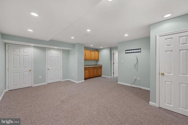 101 Glencoe Ct, Newark, DE 19702 - unfurnished living room featuring recessed lighting, baseboards, and light colored carpet