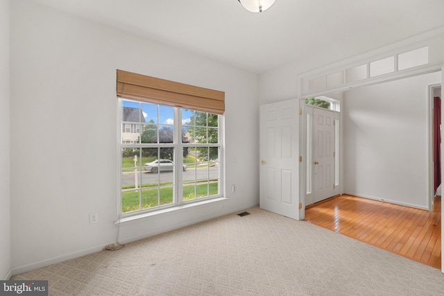 101 Glencoe Ct, Newark, DE 19702 - unfurnished bedroom with carpet flooring, baseboards, and wood finished floors