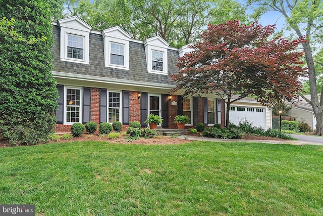 2657 Carrollton Rd, Annapolis, MD 21403 - view of front of property with brick siding, a front yard, driveway, roof with shingles, and an attached garage