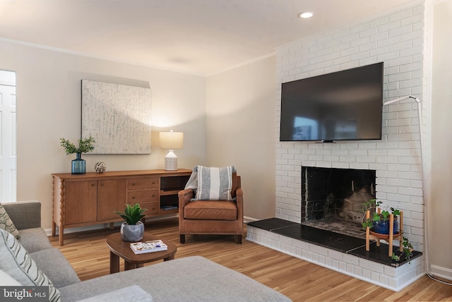 2657 Carrollton Rd, Annapolis, MD 21403 - living room with crown molding, wood finished floors, a brick fireplace, and recessed lighting