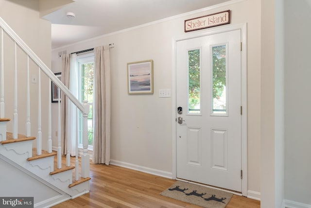 2657 Carrollton Rd, Annapolis, MD 21403 - entryway featuring crown molding, light wood-type flooring, and stairway