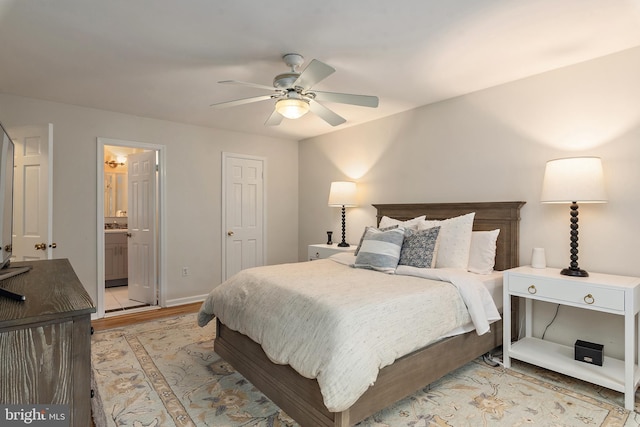 2657 Carrollton Rd, Annapolis, MD 21403 - bedroom with light wood-style floors, a ceiling fan, and ensuite bathroom