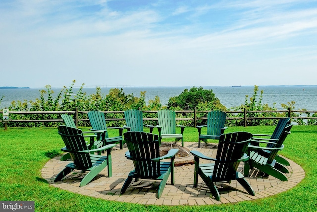 2657 Carrollton Rd, Annapolis, MD 21403 - view of grassy yard featuring an outdoor fire pit, a water view, and a patio area