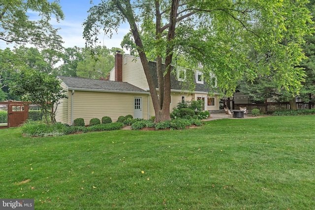 2657 Carrollton Rd, Annapolis, MD 21403 - rear view of property with a patio and a chimney