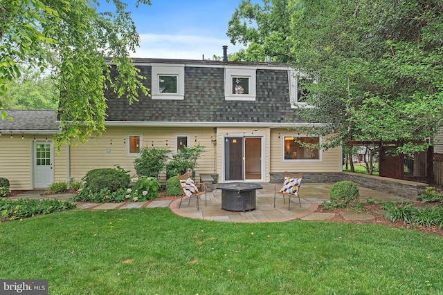 2657 Carrollton Rd, Annapolis, MD 21403 - rear view of property with a shingled roof, a patio, an outdoor fire pit, a lawn, and mansard roof