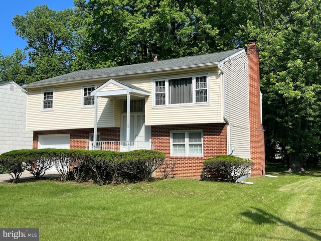 727 Fulton St S, Cherry Hill, NJ 08002 - split foyer home featuring brick siding, a chimney, a front lawn, and a garage