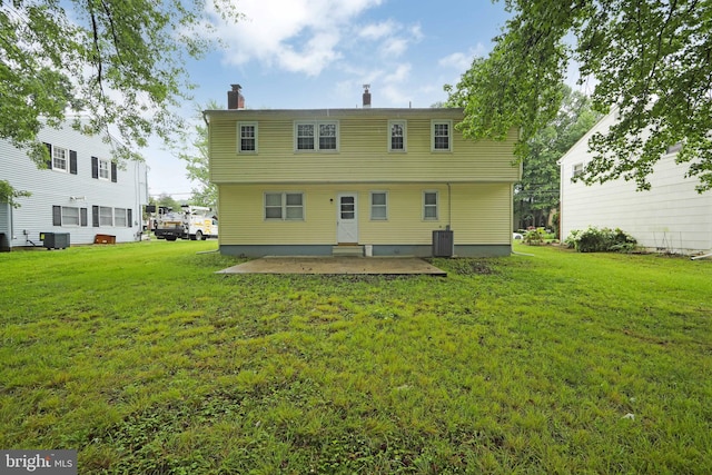 727 Fulton St S, Cherry Hill, NJ 08002 - rear view of house with a chimney, a patio, and a yard