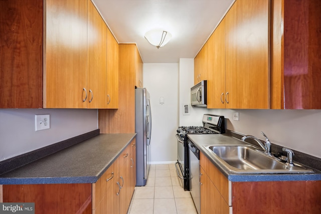 8601 Manchester Rd Unit 319, Silver Spring, MD 20901 - kitchen with appliances with stainless steel finishes, light tile patterned floors, brown cabinets, and dark countertops