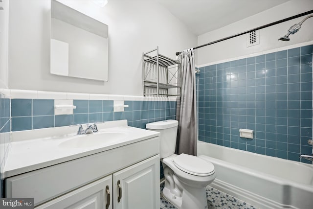 8601 Manchester Rd Unit 319, Silver Spring, MD 20901 - bathroom with vanity, shower / tub combo, tile walls, and a wainscoted wall
