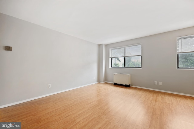8601 Manchester Rd Unit 319, Silver Spring, MD 20901 - unfurnished room featuring light wood-type flooring and radiator