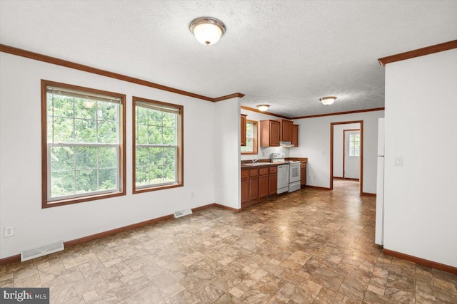 4767 S Ox Rd, Edinburg, VA 22824 - kitchen featuring stone finish floors, crown molding, white appliances, a textured ceiling, and brown cabinets